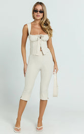 Susannah Cream Pinstripe Split-Hem Cropped Trousers – Tailored Elegance in Motion